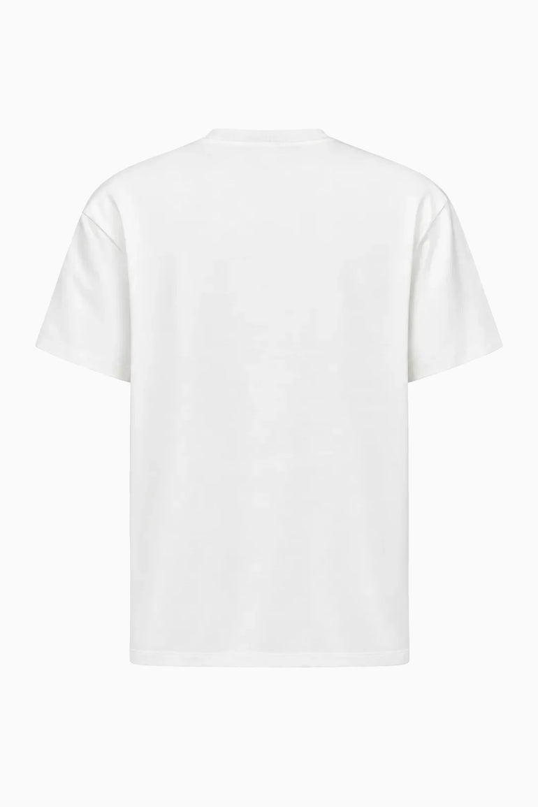 IH NOM UH NIT brown cotton T-shirt featuring the Family Print artwork with a Dobermann and editorial fashion portrait